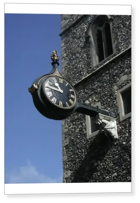 Print : Ornate clock on a wall bracket on the facade of a church, Canterbury, Kent, England Print : Ornate clock on a wall bracket on the facade of a church, Canterbury, Kent, England