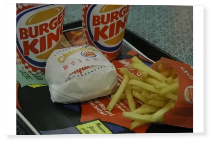 Print : Cheeseburger, chips and soft drinks on a tray at a Burger King restaurant, Canterbury