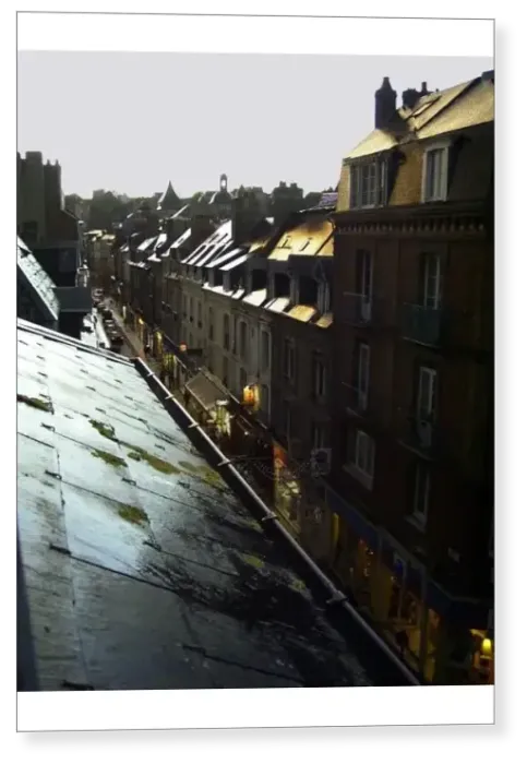 Print : Typical French town houses with wet rooftops glistening in a golden light after rain Print : Typical French town houses with wet rooftops glistening in a golden light after rain