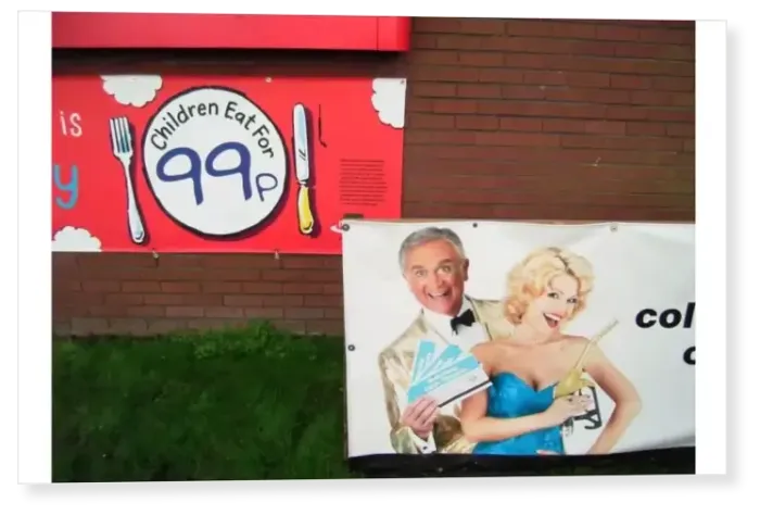 Print : Advertisements to lure customers of all ages, motorway service station brick wall with posters