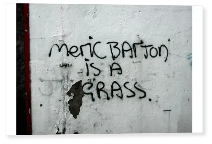 Print : Meric Barton is a grass: graffiti on the side of a building denouncing a local person
