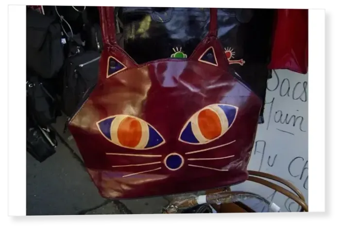 Print : Leather bag decorated with motif of a cats face, market stall, Dieppe, Seine-Maritime Print : Leather bag decorated with motif of a cats face, market stall, Dieppe, Seine-Maritime
