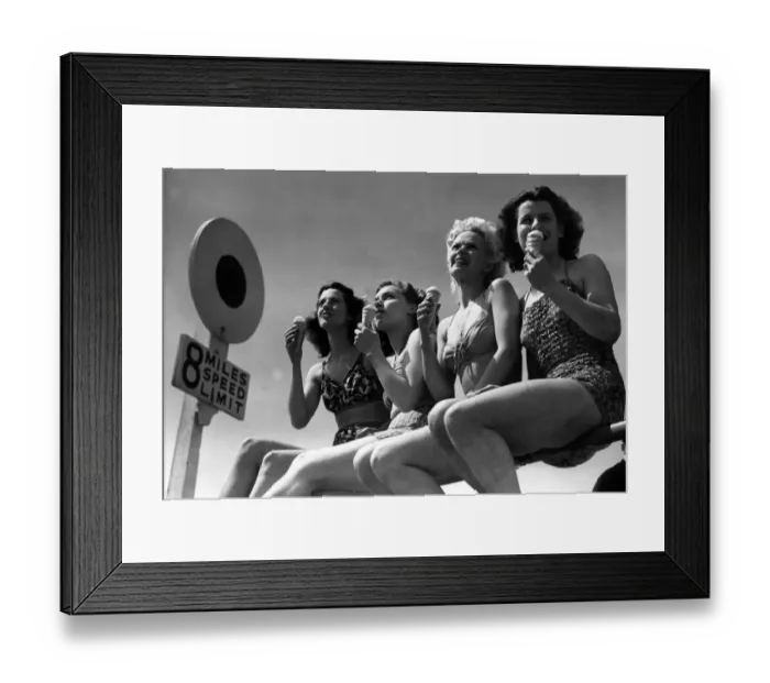 Framed Print : Four young women enjoying the sun sitting on the rails on Bournemouth sea front while Framed Print : Four young women enjoying the sun sitting on the rails on Bournemouth sea front while