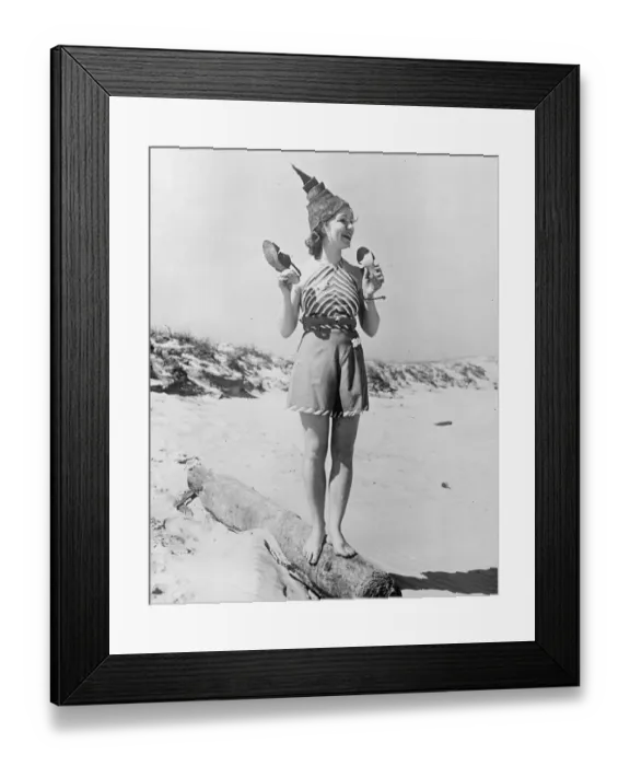 Framed Print : Warm weather brings nude beach fashion. A new summer beach fashion worn by Lorraine