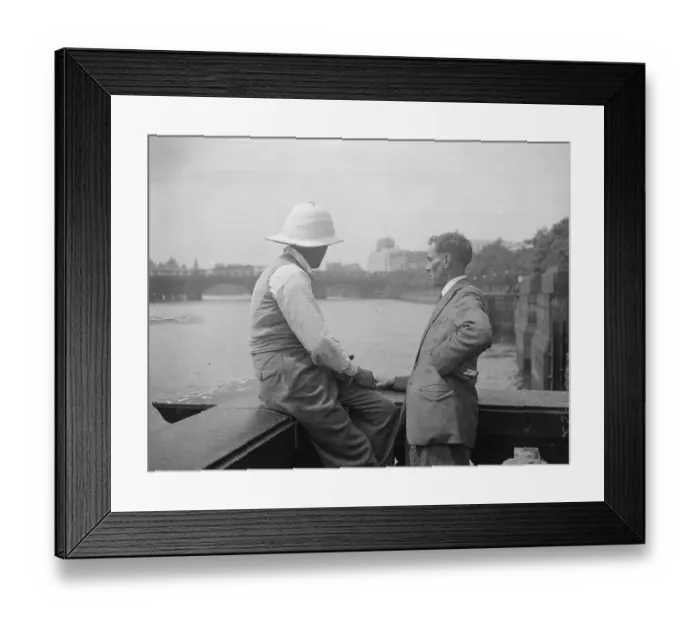Framed Print : Pith Helmets on the embankment. A visitor to London was seen wearing a pith helmet Framed Print : Pith Helmets on the embankment. A visitor to London was seen wearing a pith helmet