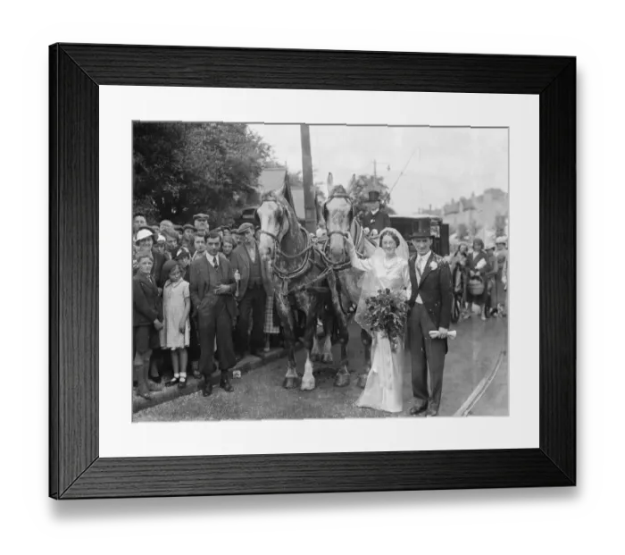 Framed Print : An old fashion wedding at Eltham Parish church. The bride and groom stand next to the horse Framed Print : An old fashion wedding at Eltham Parish church. The bride and groom stand next to the horse
