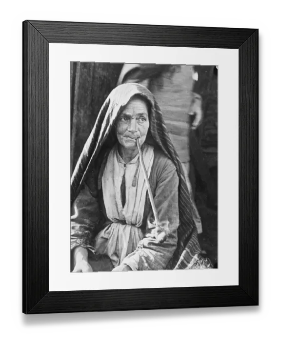 Framed Print : Elderly Jewish woman pipe addict of a Russian ghetto dressed in coarse cloths and shawl Framed Print : Elderly Jewish woman pipe addict of a Russian ghetto dressed in coarse cloths and shawl