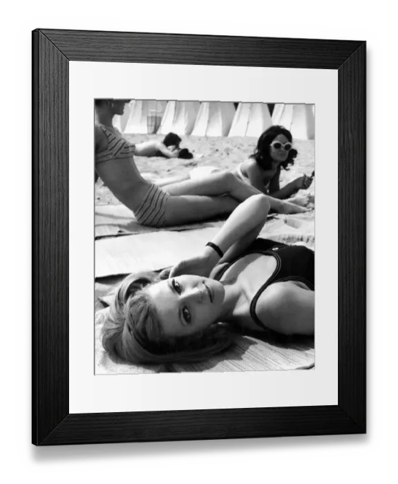 Framed Print : Three young women meet up at the beach for a relaxing time during their summer break Framed Print : Three young women meet up at the beach for a relaxing time during their summer break