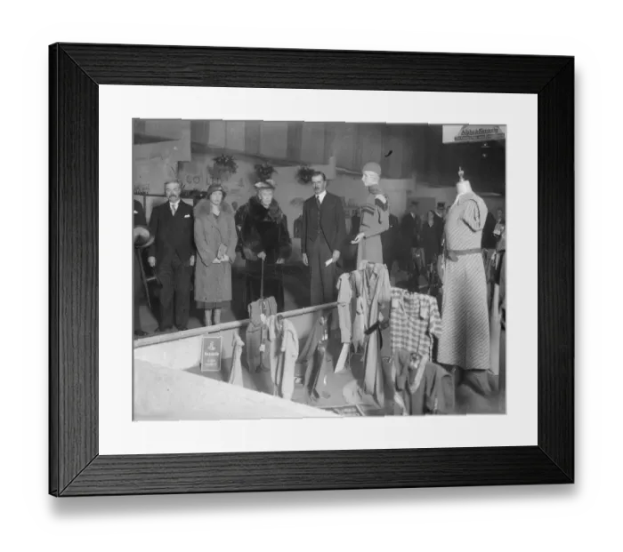 Framed Print : Queen watches fashion parade at British textile exhibition. The Queen, accompanied