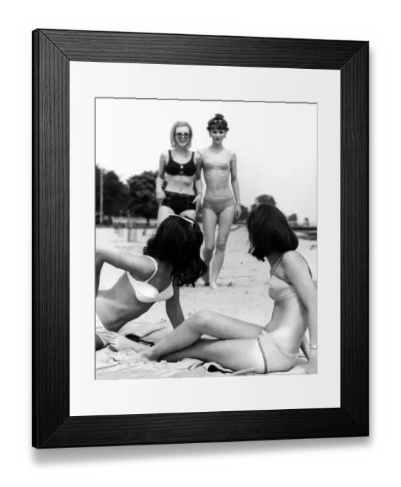Framed Print : Four young women meet up at the beach for a relaxing time during their summer break Framed Print : Four young women meet up at the beach for a relaxing time during their summer break