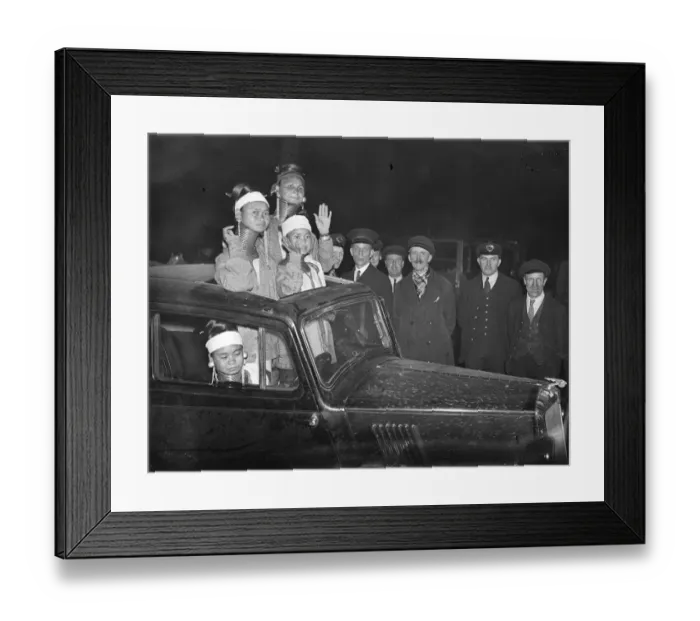 Framed Print : They found the sunshine roof invaluable. Giraffe necked women arrive in London Framed Print : They found the sunshine roof invaluable. Giraffe necked women arrive in London