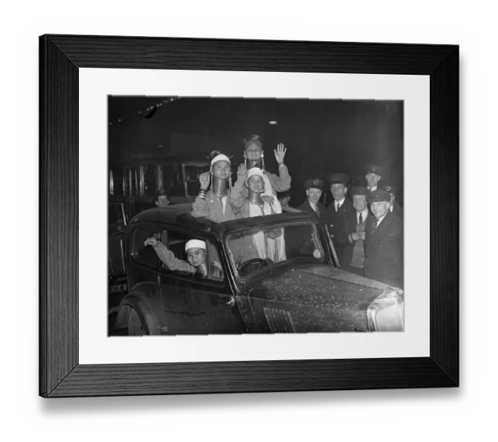 Framed Print : They found the sunshine roof invaluable. Giraffe necked women arrive in London Framed Print : They found the sunshine roof invaluable. Giraffe necked women arrive in London