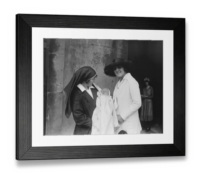 Framed Print : A nurse holds the son of actor Lupino Lane at his christening at St Georges Church Framed Print : A nurse holds the son of actor Lupino Lane at his christening at St Georges Church