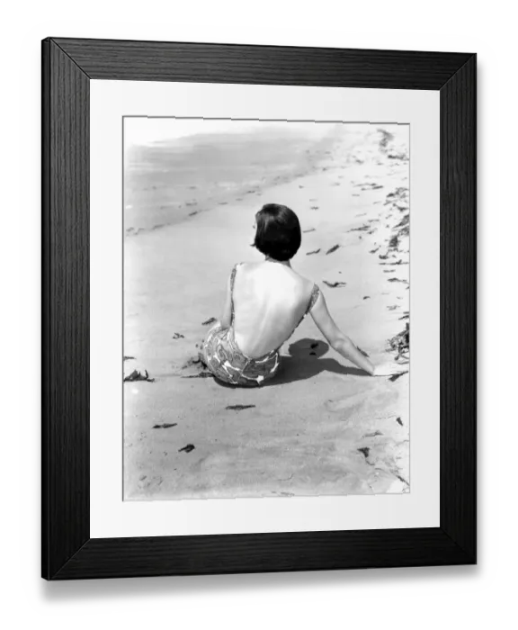 Framed Print : A young woman relaxing on the beach April 1953 Framed Print : A young woman relaxing on the beach April 1953
