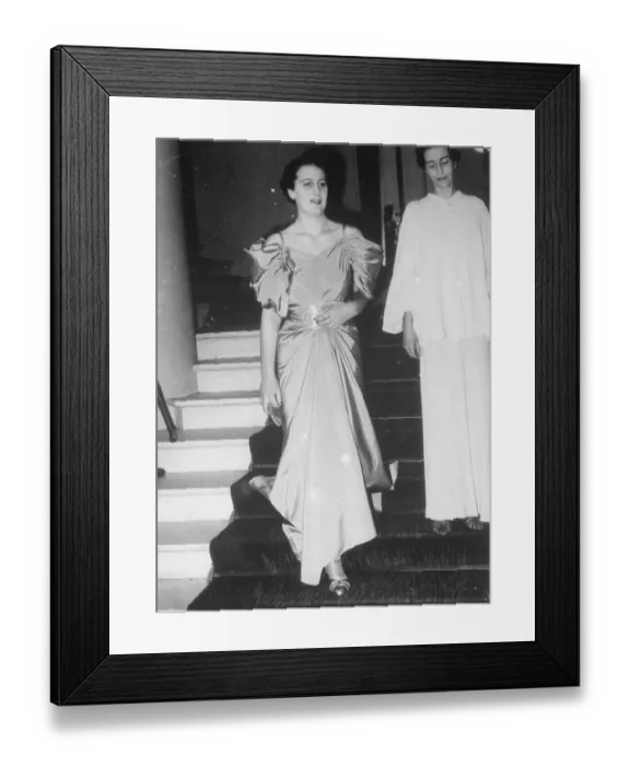 Framed Print : uncaptioned Well dressed woman walking down stairs