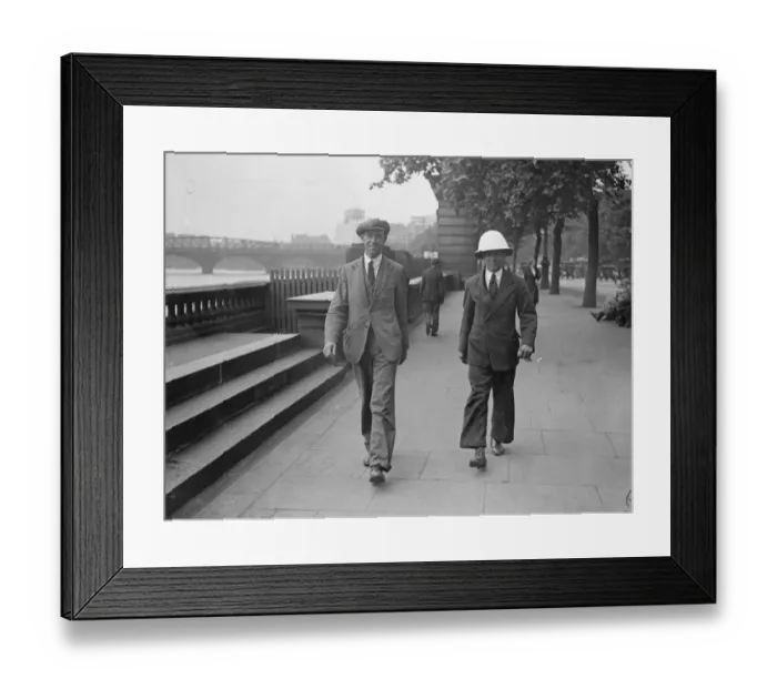 Framed Print : Pith Helmets on the embankment. A visitor to London was seen wearing a pith helmet Framed Print : Pith Helmets on the embankment. A visitor to London was seen wearing a pith helmet