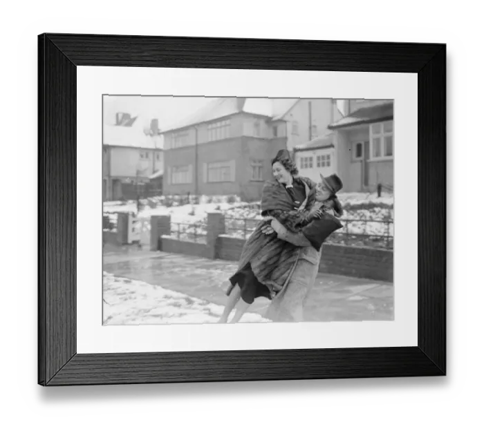 Framed Print : Miss Muriel Oxford is carried over the snow by a young man. 1937 Framed Print : Miss Muriel Oxford is carried over the snow by a young man. 1937