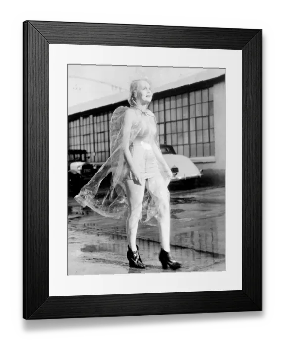 Framed Print : Weatherman didn t see through this!. Marie Wilson, the Hollywood actress, protects Framed Print : Weatherman didn t see through this!. Marie Wilson, the Hollywood actress, protects