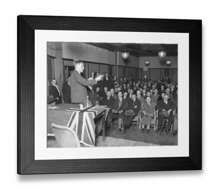 Framed Print : Mr D T Brand, the deputy high commissioner addressing young emigrants at Australia House