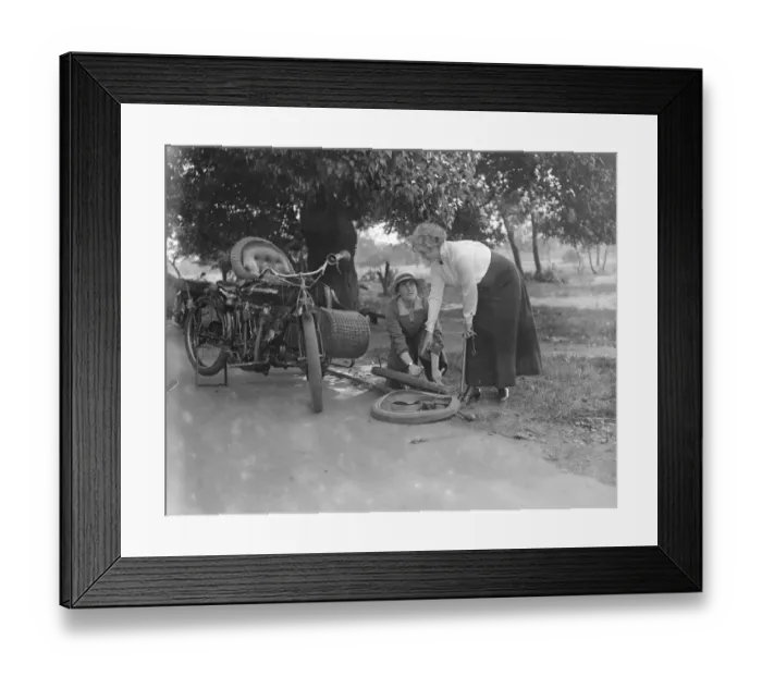 Framed Print : Miss Sybll Arundale and Miss Betty Fairfax out for a motor cycle trip Mending a Puncture Framed Print : Miss Sybll Arundale and Miss Betty Fairfax out for a motor cycle trip Mending a Puncture