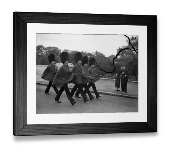 Framed Print : Keeping their arms dry. Guards wearing their capes, a sure signthat the weather