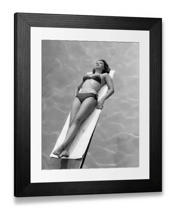 Framed Print : Woman sunbathing