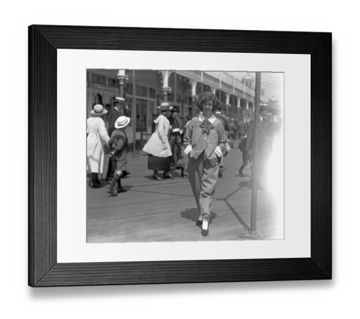 Framed Print : The right sort of clothing for the hot weather. A stroller on the Brighton seafront Framed Print : The right sort of clothing for the hot weather. A stroller on the Brighton seafront