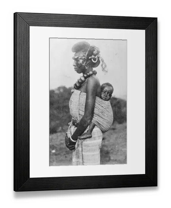 Framed Print : A lady of smart society in French Guinea with her baby on her back. She belongs
