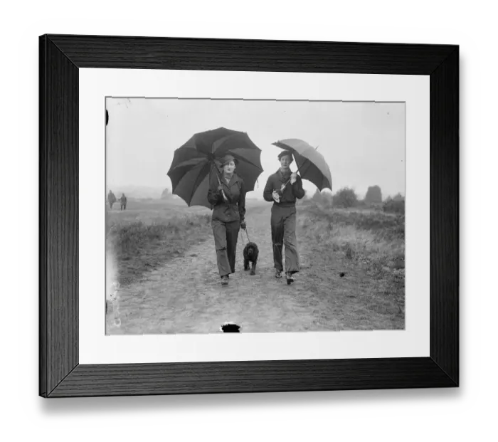 Framed Print : Lady Waleran (left) and Mrs Locker Lampson wearing waterproof trousers and carrying Framed Print : Lady Waleran (left) and Mrs Locker Lampson wearing waterproof trousers and carrying