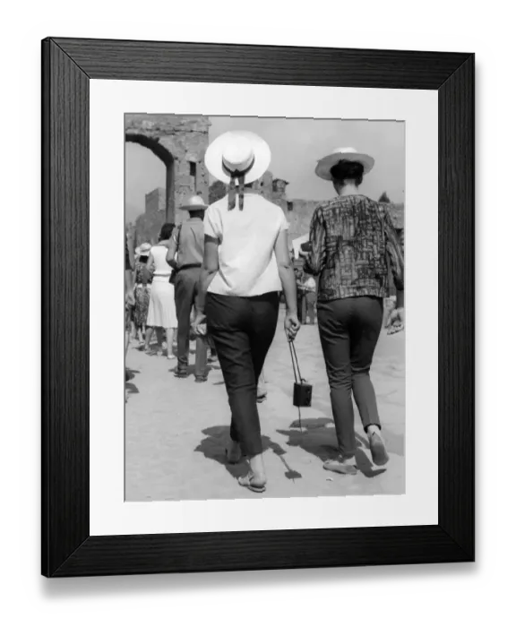 Framed Print : Two women tourists visiting Pompeii in Italy in the 1950s Framed Print : Two women tourists visiting Pompeii in Italy in the 1950s
