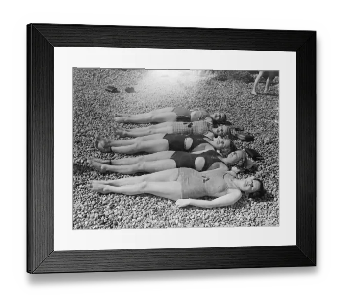 Framed Print : Girls lying on the beach in the sunshine. 25 May 1937 [?]