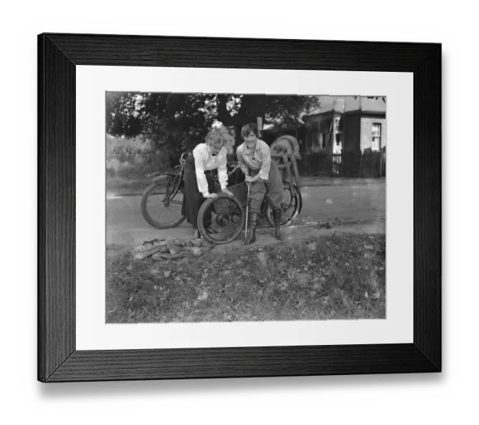 Framed Print : Miss Sybll Arundale and Miss Betty Fairfax out for a motor cycle trip Pumping Up