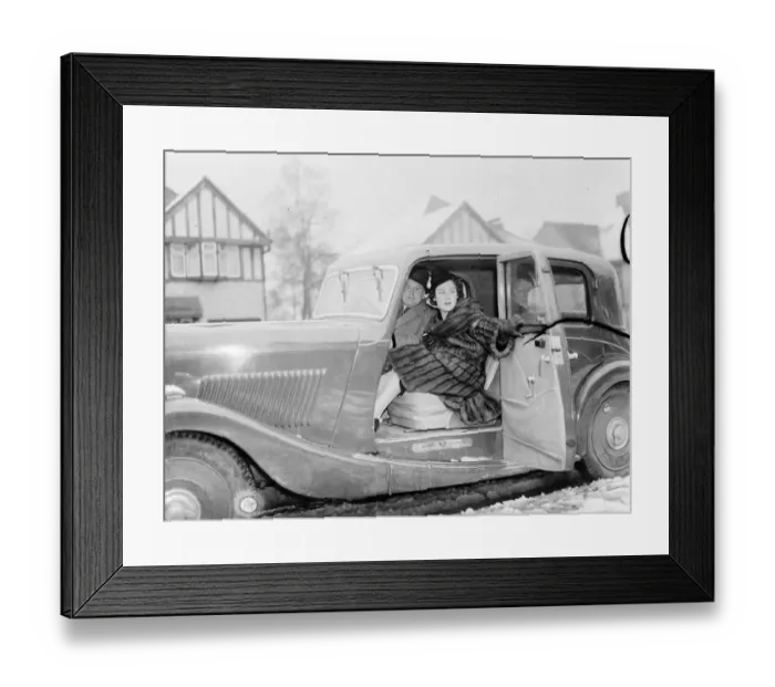 Framed Print : Miss Muriel Oxford sitting in the passenger seat of a car at the side of the road. 1937 Framed Print : Miss Muriel Oxford sitting in the passenger seat of a car at the side of the road. 1937
