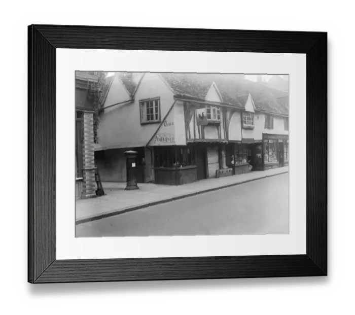 Framed Print : The old cock house shop at Eton, showing the old stocks and pillar box of years ago Framed Print : The old cock house shop at Eton, showing the old stocks and pillar box of years ago
