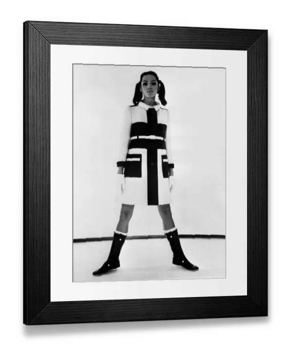 Framed Print : This striking Winter topcoat could only have been created by Courreges. On a slender Framed Print : This striking Winter topcoat could only have been created by Courreges. On a slender