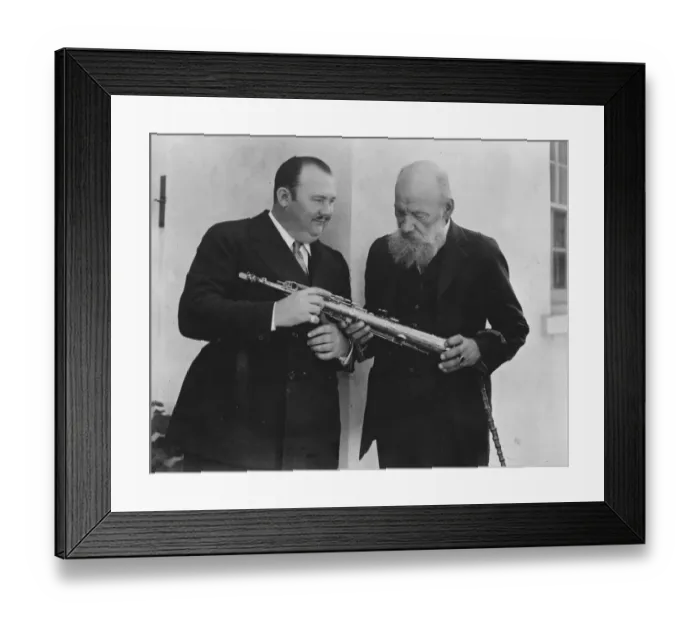 Framed Print : Count Tolstoy Falls for American tunes. Pau Whitman showing Count Tolstoy his