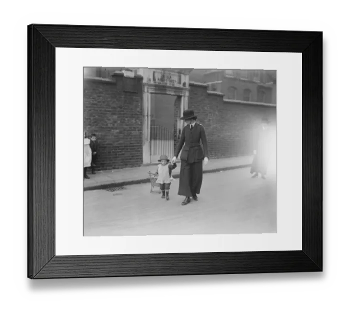Framed Print : Woman Police Force Officer helps a child Framed Print : Woman Police Force Officer helps a child