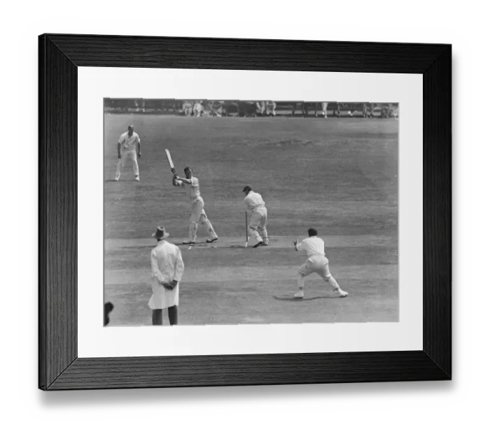 Framed Print : Surrey versus Sussex at Brighton. Ducat hits a boundary. 22 July 1925
