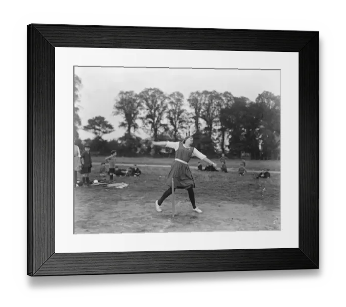 Framed Print : Brilliant girl bowler. An over - arm action study of Miss Ryle, the Captain of Framed Print : Brilliant girl bowler. An over - arm action study of Miss Ryle, the Captain of