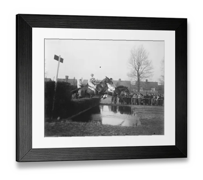 Framed Print : Grand Military Meeting at Sandown Taking the water jump in the Talley, Ho Hunters
