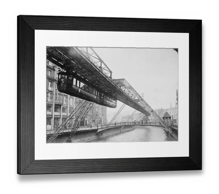 Framed Print : The suspension railway crossing the River Wupper. 28 September 1923 Framed Print : The suspension railway crossing the River Wupper. 28 September 1923
