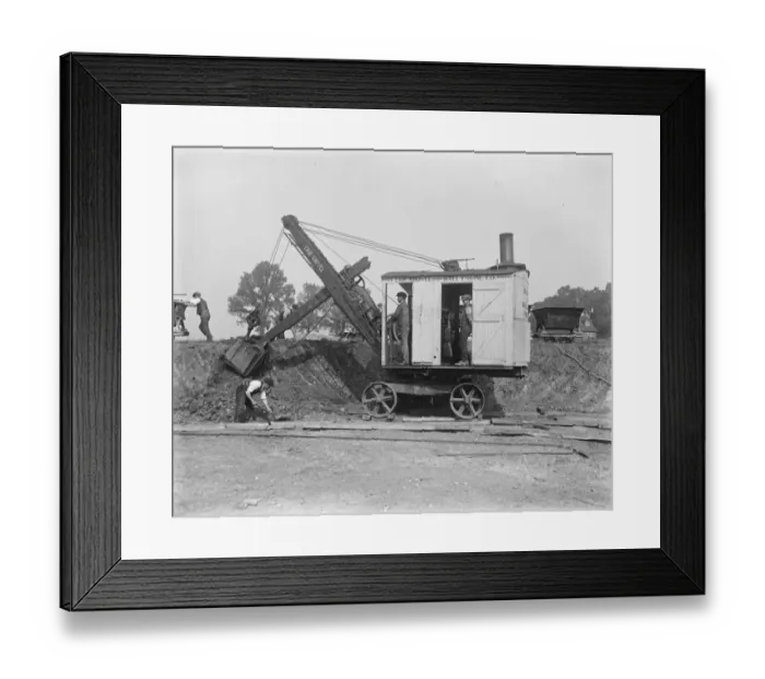 Framed Print : Building a concrete village at Braintree, Essex The steam shovel, which has been