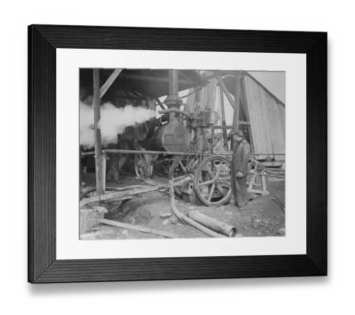 Framed Print : Coal from war wrecked coalfield of Lens. A small section of one of the pumps
