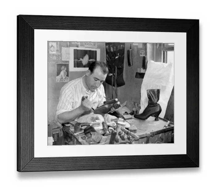 Framed Print : Making of wooden shoe lasts ( W. H. Smith, Sloane Street ). Finishing off a pair Framed Print : Making of wooden shoe lasts ( W. H. Smith, Sloane Street ). Finishing off a pair
