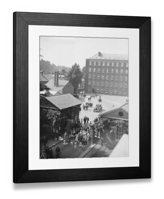Framed Print : Employees leaving the works of Messrs Heathcoat and Co at Tiverton. 15 July 1929 Framed Print : Employees leaving the works of Messrs Heathcoat and Co at Tiverton. 15 July 1929