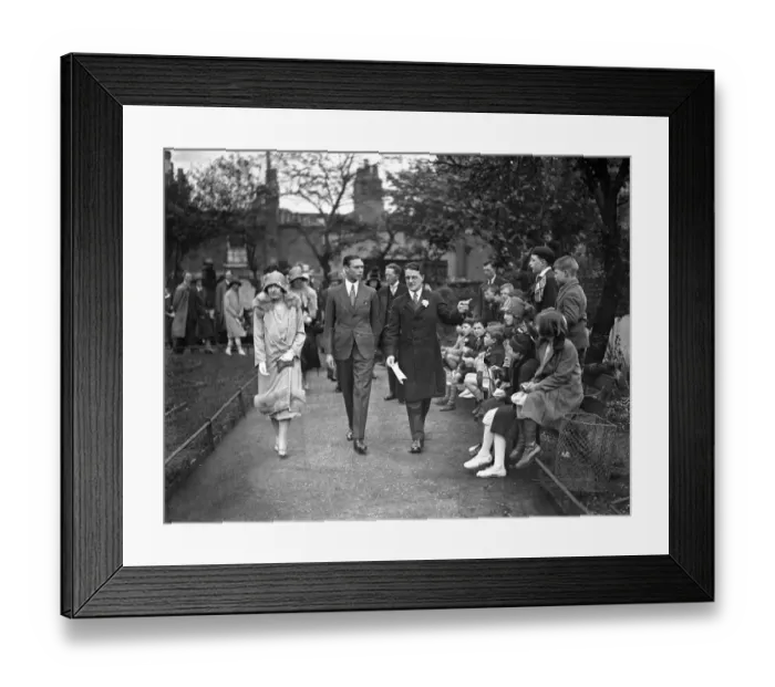 Framed Print : The Duke and Duchess of York with the warden ( Rev J W Graves ) on their visit to Framed Print : The Duke and Duchess of York with the warden ( Rev J W Graves ) on their visit to