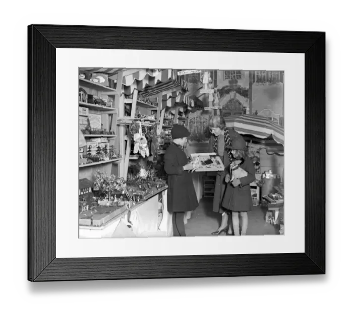 Framed Print : Lady Verney (striped scarf) in the toy and bookshop she has opened in the garage Framed Print : Lady Verney (striped scarf) in the toy and bookshop she has opened in the garage