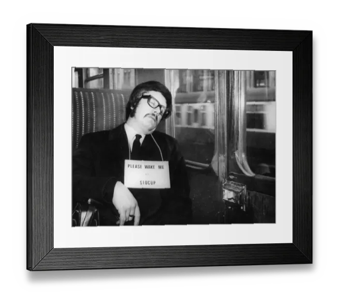 Framed Print : Commuter asleep on the train wearing a sign saying Please wake me up at Sidcup Framed Print : Commuter asleep on the train wearing a sign saying Please wake me up at Sidcup