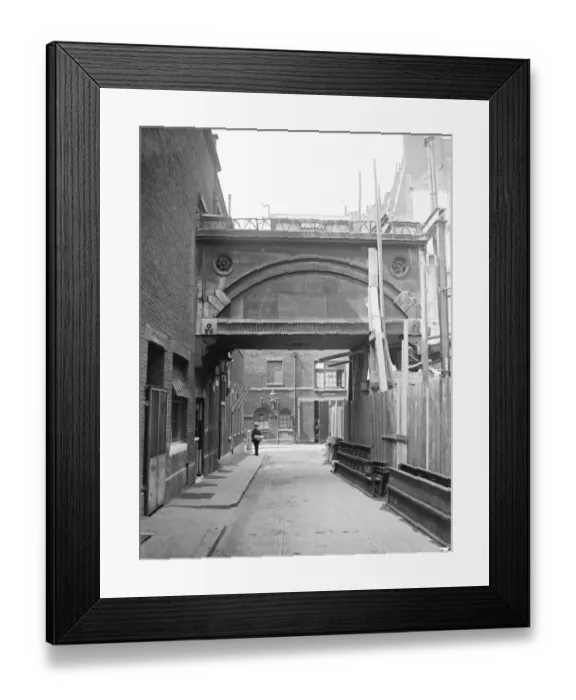 Framed Print : Difficulties of demolishing a quaint London bridge. Standing at the back of