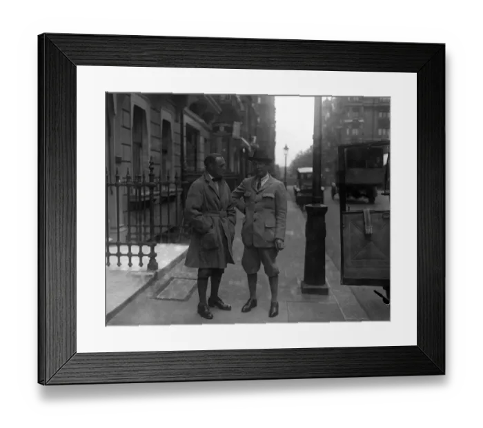 Framed Print : Mary Pickfords former husband in London. Mr Owen Moore ( wearing hat ) talks to a friend Framed Print : Mary Pickfords former husband in London. Mr Owen Moore ( wearing hat ) talks to a friend